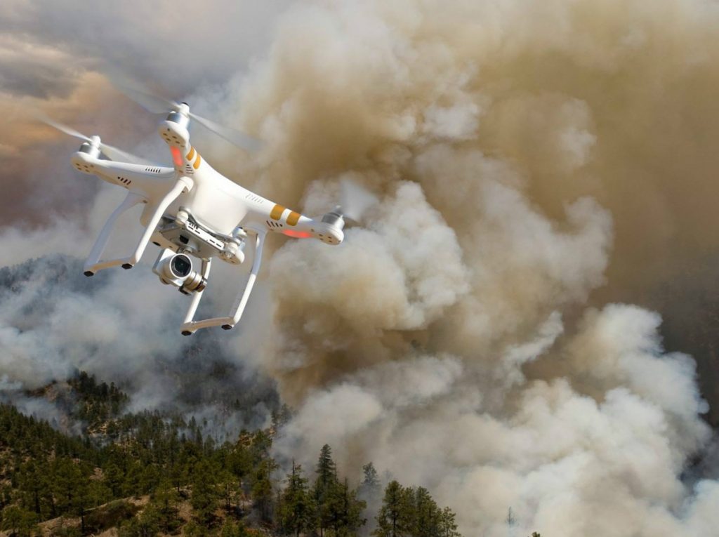 A drone flying over a wildfire. (Bureau of Land Management photo) 