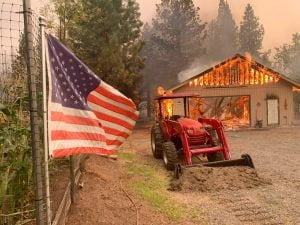 Structure being burned from wildfire in California