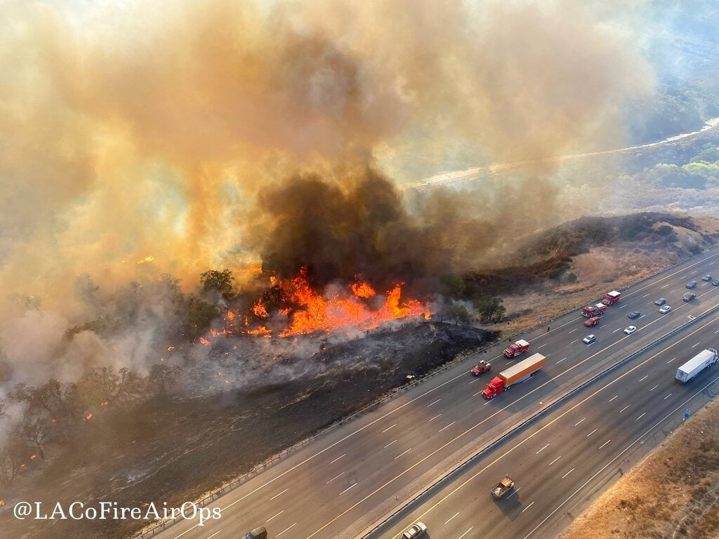 Firefighters Advance on Fire That Shut CA Highway